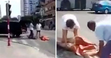 watch shocking moment dead body falls out of moving hearse in busy