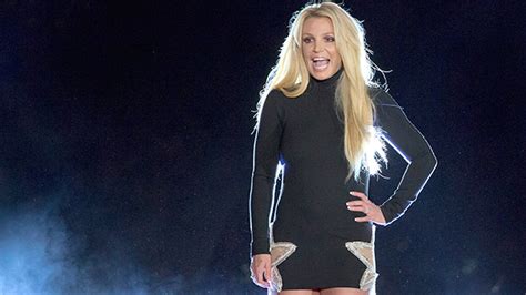 britney spears rocks short shorts while doing a handstand