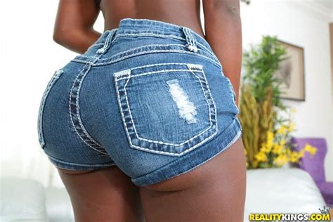 ebony girl sheds shorts and hot panties to reveal big booty and get at pussy porn pics
