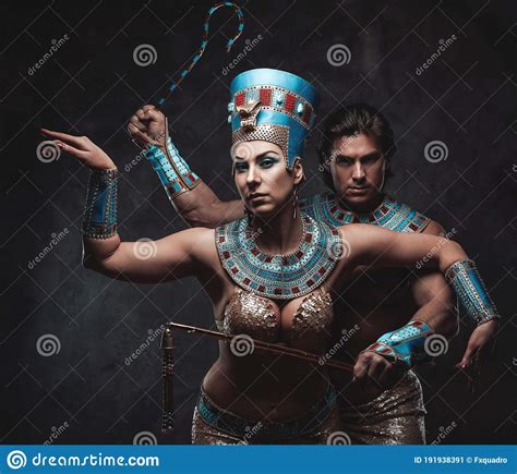 couple dressed up in traditional egyptian costumes standing in