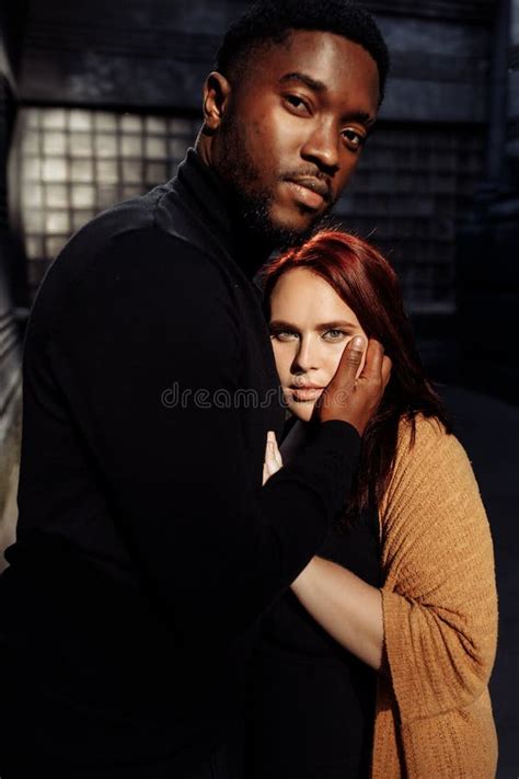 Portrait Of Attractive African American Man Gently Cuddle Beautiful