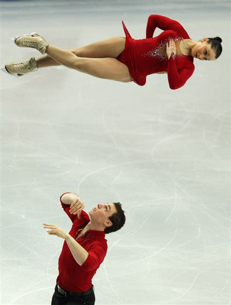 french pairs skaters popova and massot in the middle of their triple