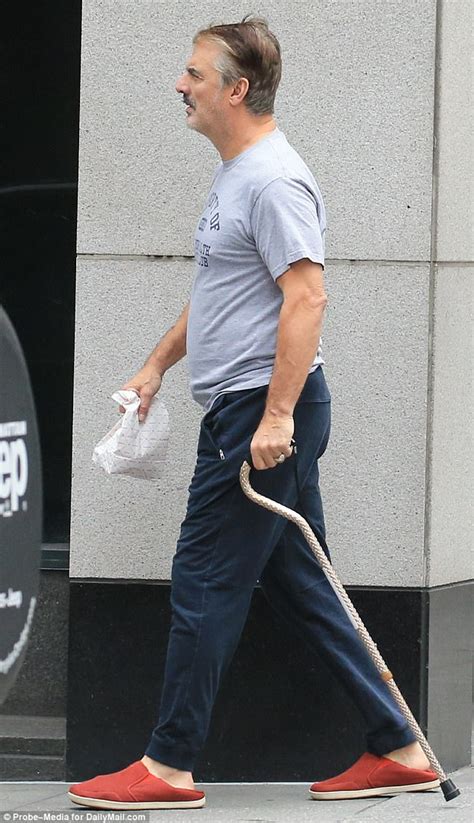 chris noth 62 hobbles along in nyc with walking cane daily mail online