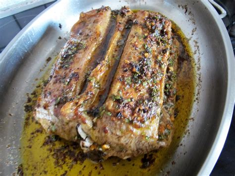 lammruecken  knochen mit kraeuter knoblauch kruste von