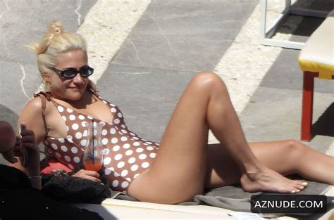 pixie lott sexy in a polka dot swimsuit while relaxing by the pool in