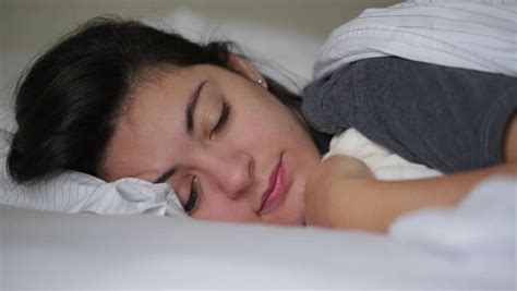 Pensive Shot Of Girl Laying Down In Bed Closing Her Eyes