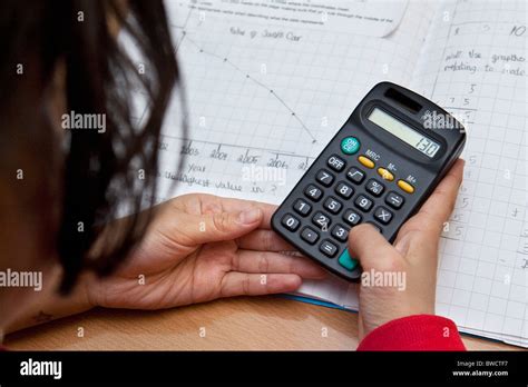 child   calculator  school maths lesson stock photo alamy