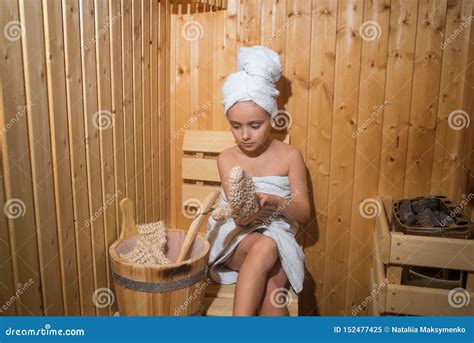 Girl Enjoying A Relaxing Stay In The Sauna Young Girl Relaxing In Sauna