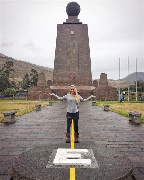 woman standing  front   monument   arms wide open  hands outstretched
