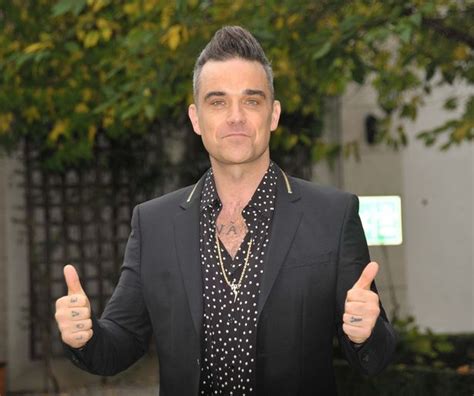 robbie williams wishes he was gay so he could have sex on tap as he admits he does have