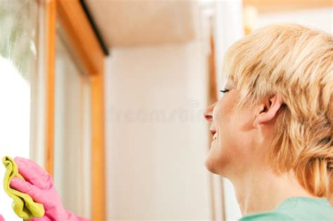 Mature Woman Cleaning Window Cleaning Window Stock Images
