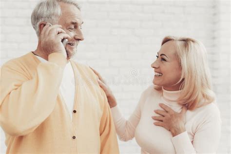 Smiling Old Man And Woman Talking On Smartphone Stock Image Image Of