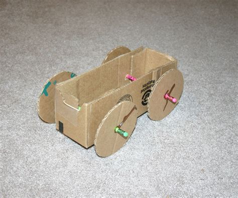 rubber band powered cardboard car  steps instructables