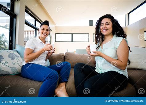 Portrait Of Lesbian Couple Having A Cup Of Coffee Stock Image Image