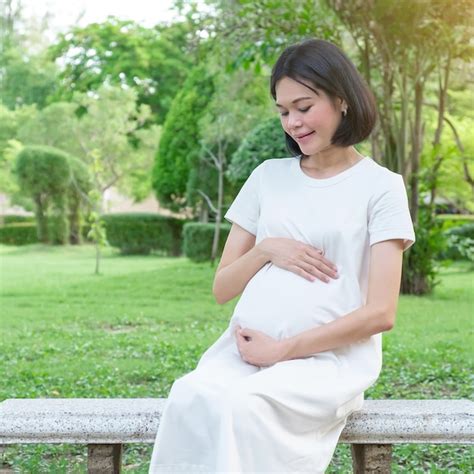 Premium Photo A Pregnant Asian Woman Wearing Casual Clothes Sitting