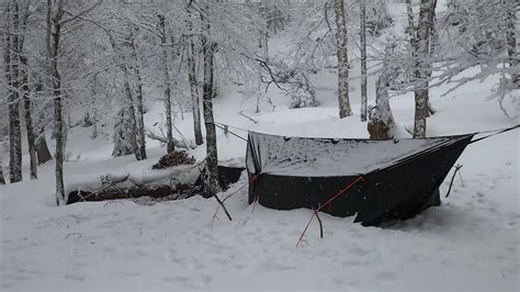 embracing winter spending  night   tarp wall tent   stop snowfall youtube