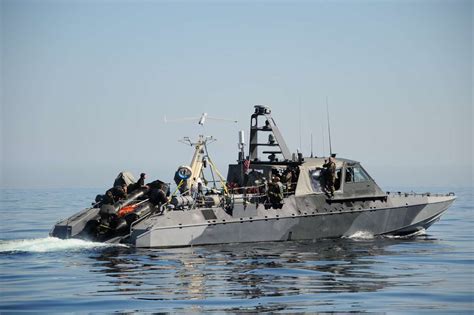 navy stealthy special operations boats  zooming   middle east  drive