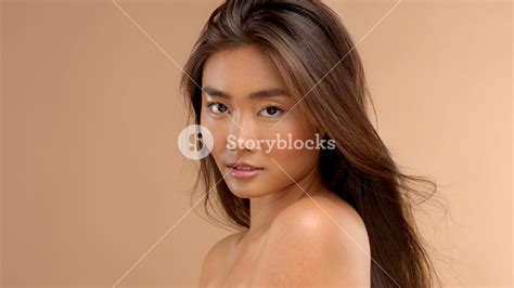 profile portrait of asian japanese thai model watching to the camera