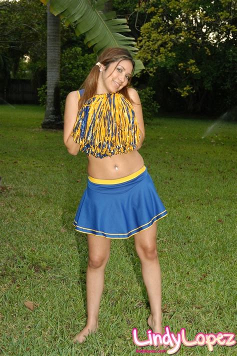 Hot Cheerleader In A Short Skirt With A Sparkling Belly