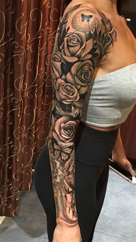 A Woman With Tattoos On Her Arm And Leg