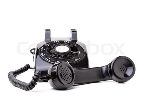 an old black vintage rotary style telephone off the hook