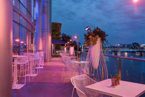 outdoor dining area  tables  chairs overlooking  water