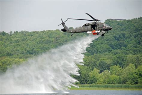 york army national guard tests firehawk helicopter firefighting system  mohawk river