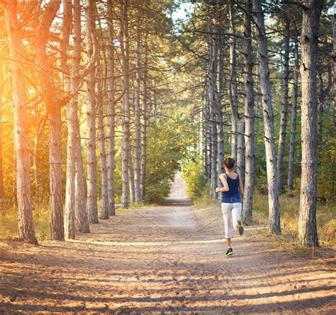 young woman running  forest  fitness woman  jogging