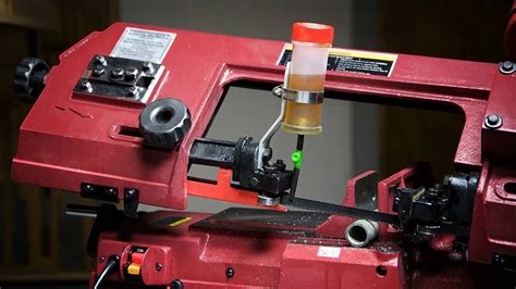 simple   drip oiler   valuable addition   horizontal bandsaw   lacking