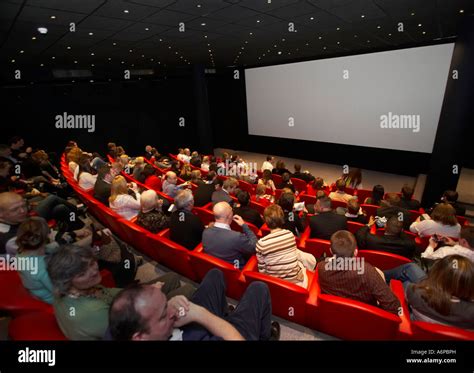 people watching  cinema screen   theatre stock photo  alamy