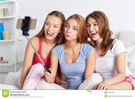Teen Girls With Smartphone Taking Selfie At Home Stock