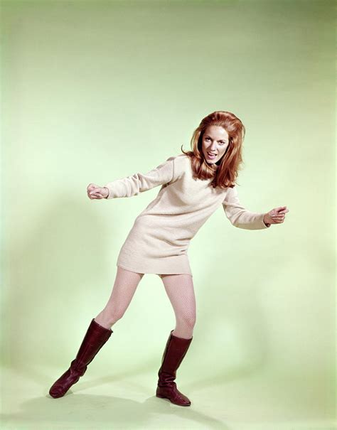 1960s woman dancer boots tan mini skirt photograph by vintage images