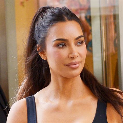 kim kardashian highlights her famous backside in a skintight dress as