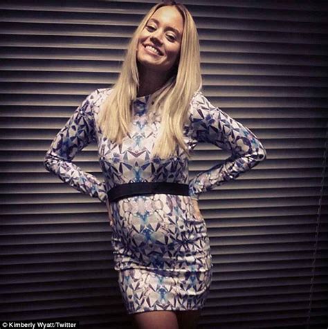 pregnant kimberly wyatt cradles growing bump as she wows in