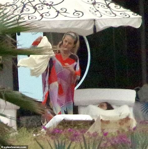heidi klum is topless in racy instagram snap as she lounges by the pool