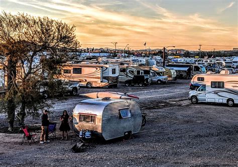 clusters of gleaming rv s vans and motorhomes flash into view