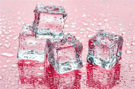 ice cubes  pink background premium photo
