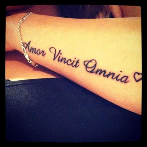 amor vincit omnia have this on the back of my neck steven has it on his leg