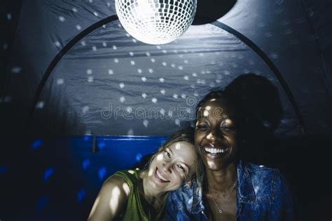 lgbt couple facial expression with disco ball at night