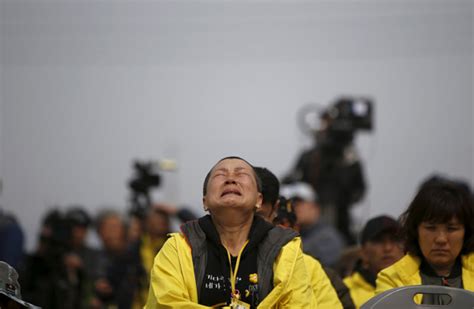 a mother of a victim who was aboard the sunken ferry sewol cries at a memorial ceremony ahead of the