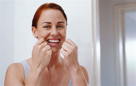 Perfect Your Smile By Flossing Regularly Portrait Of An Attractive