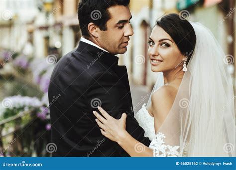Gorgeous Beautiful Exotic Brunette Bride And Handsome Groom Posing