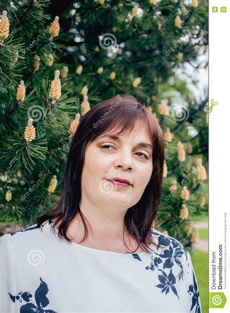 Mature Real Fat Brunette Woman In Green Spring Park Lifestyle Concept