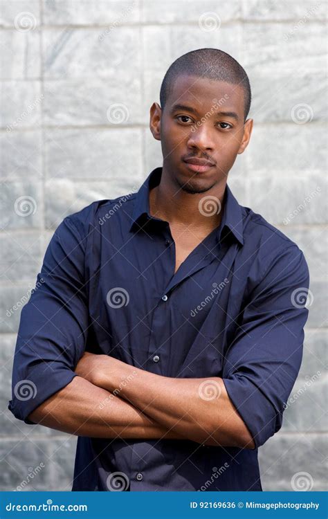 handsome black man staring   face expression stock photo