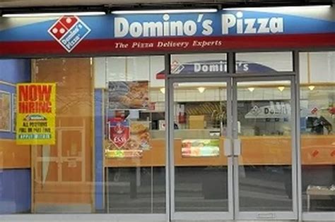 dominos franchise fined  illegal workers surrey