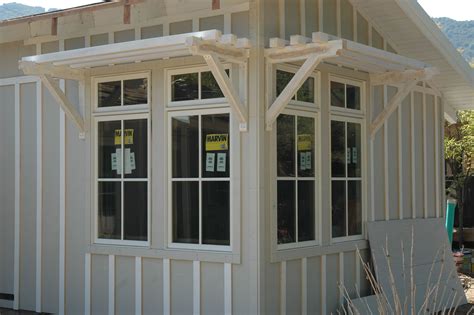 marvin clad ultimate double hung windows stone white exterior   simulated divided grids