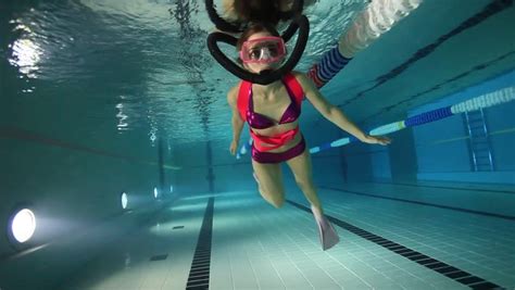 female scuba diver playing with regulator underwater in the pool stock footage video 7332406