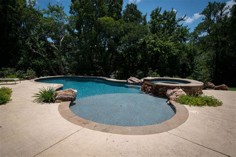 sloped yard allison landscpe pool company