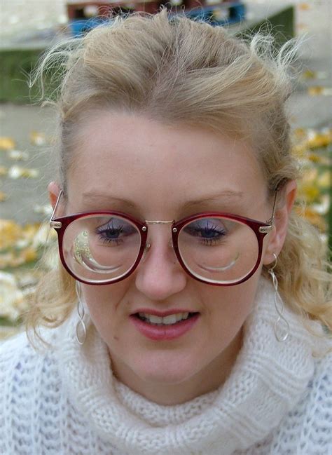 Laet Cute Blonde Girl With Thick Lens Glasses A Photo