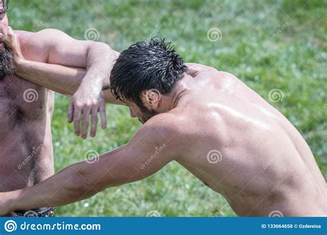turkish people performing oil wrestling or grease wrestling editorial